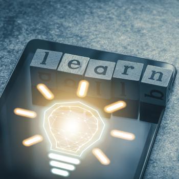 Learn with a lightbulb displaying on a tablet.