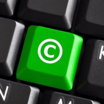 Green-colored key on keyboard with copyright symbol